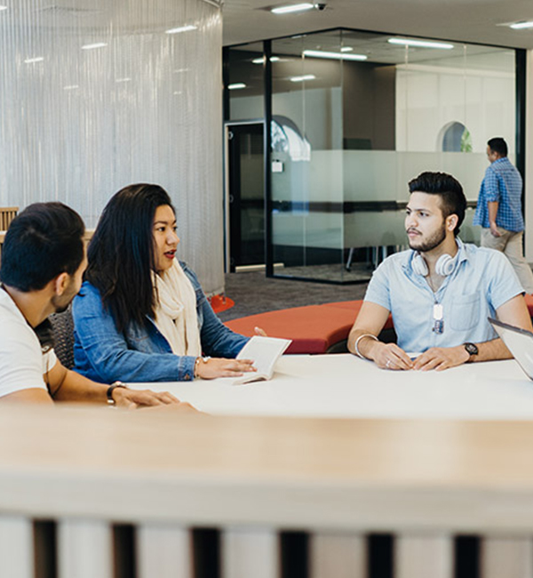 ACU history students discussing their work on campus